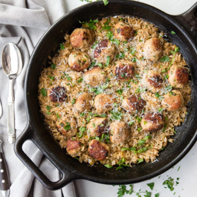 brown rice and turkey meatballs in a cast iron skillet