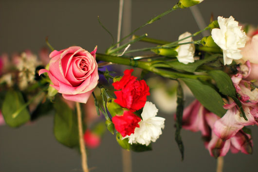 pink roses, carnations tied to a floral chandelier