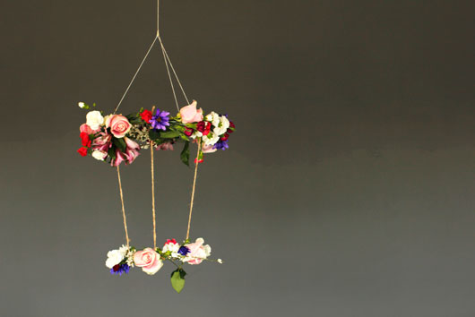 DIY Hanging floral chandelier with carnations and roses hanging from the ceiling 