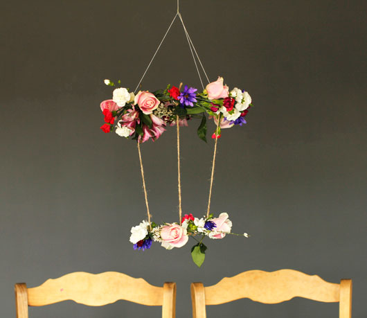 DIY Hanging Floral Chandelier against a gray wall