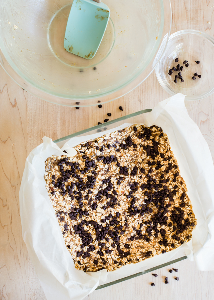 homemade chocolate chip granola bars in a glass Pyrex dish