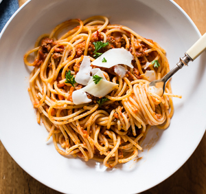 a bowl of spaghetti and Bolognese sauce 