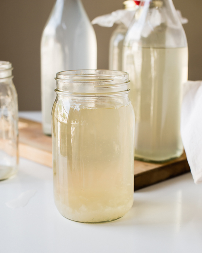 making-water-kefir in a glass mason jar