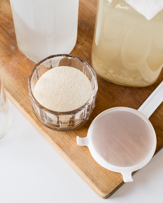 organic evaporated cane juice in a glass on a cutting board