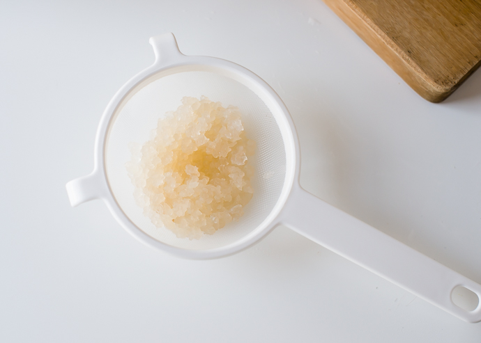 water kefir grains in a sieve