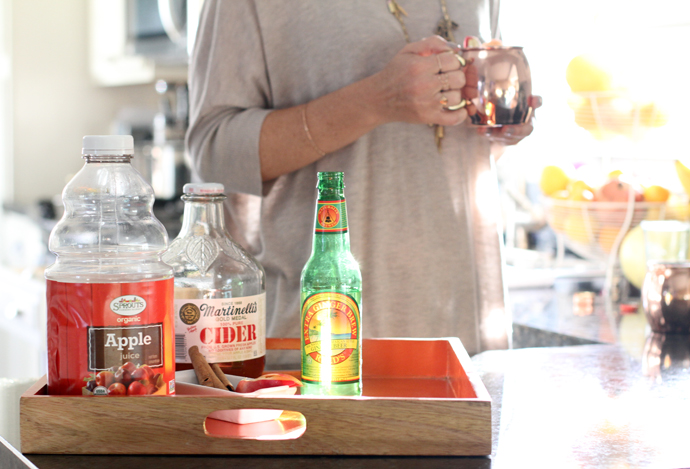 apple-cider-moscow-mule-ingredients on a wooden tray