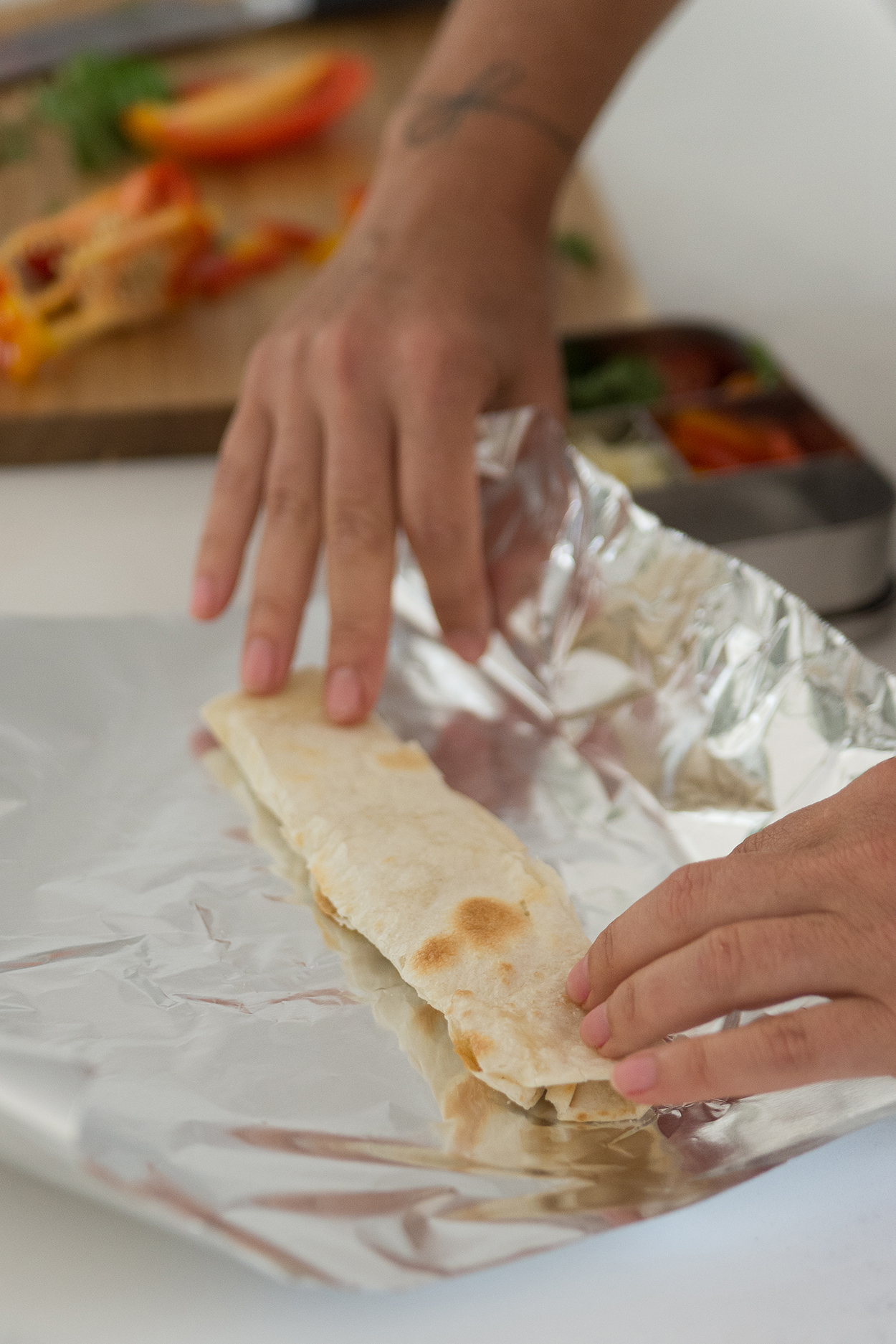 Andrea making a cheese roll up for a bento box lunch