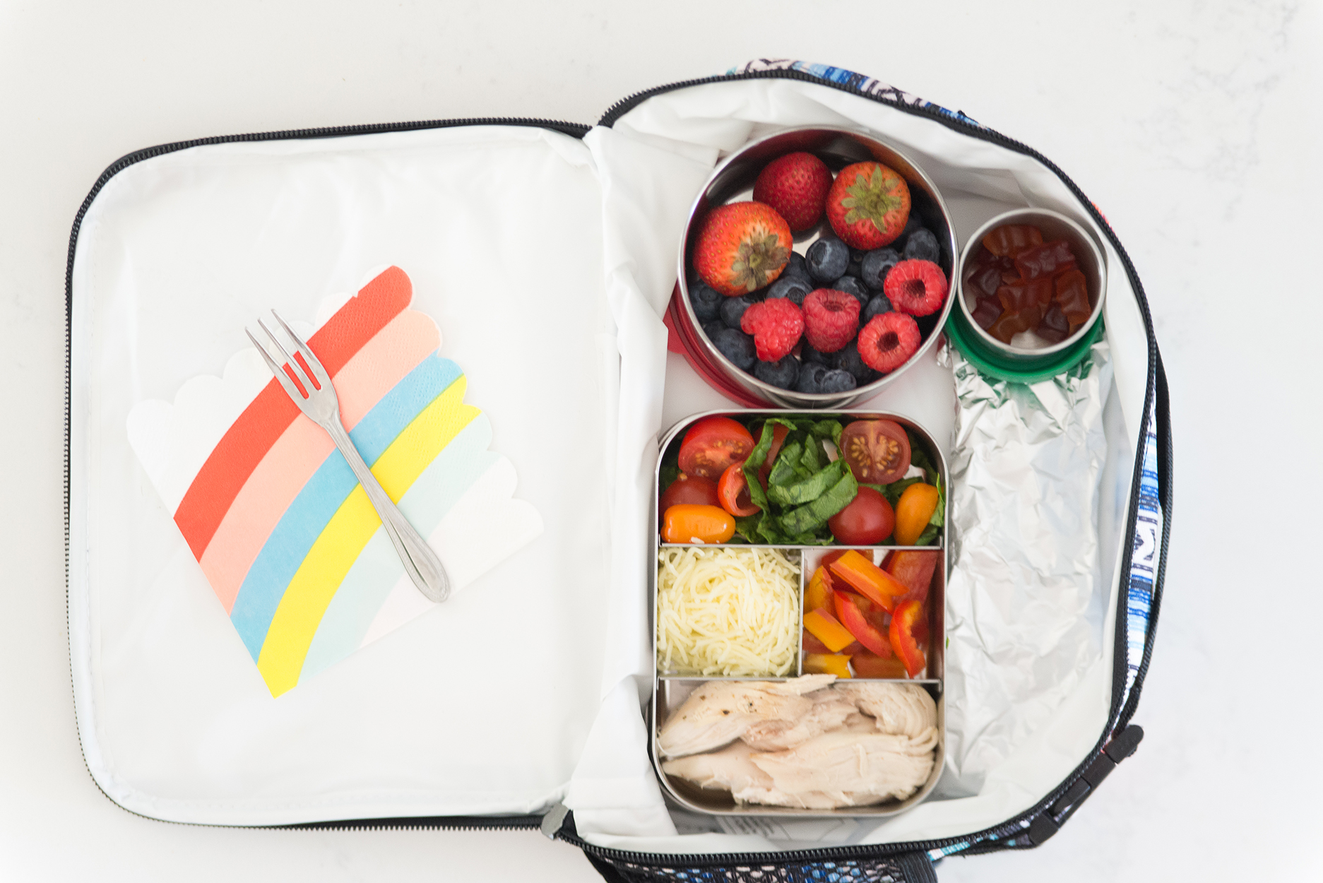 lunch box with a bento box inside full of fruit and veggies