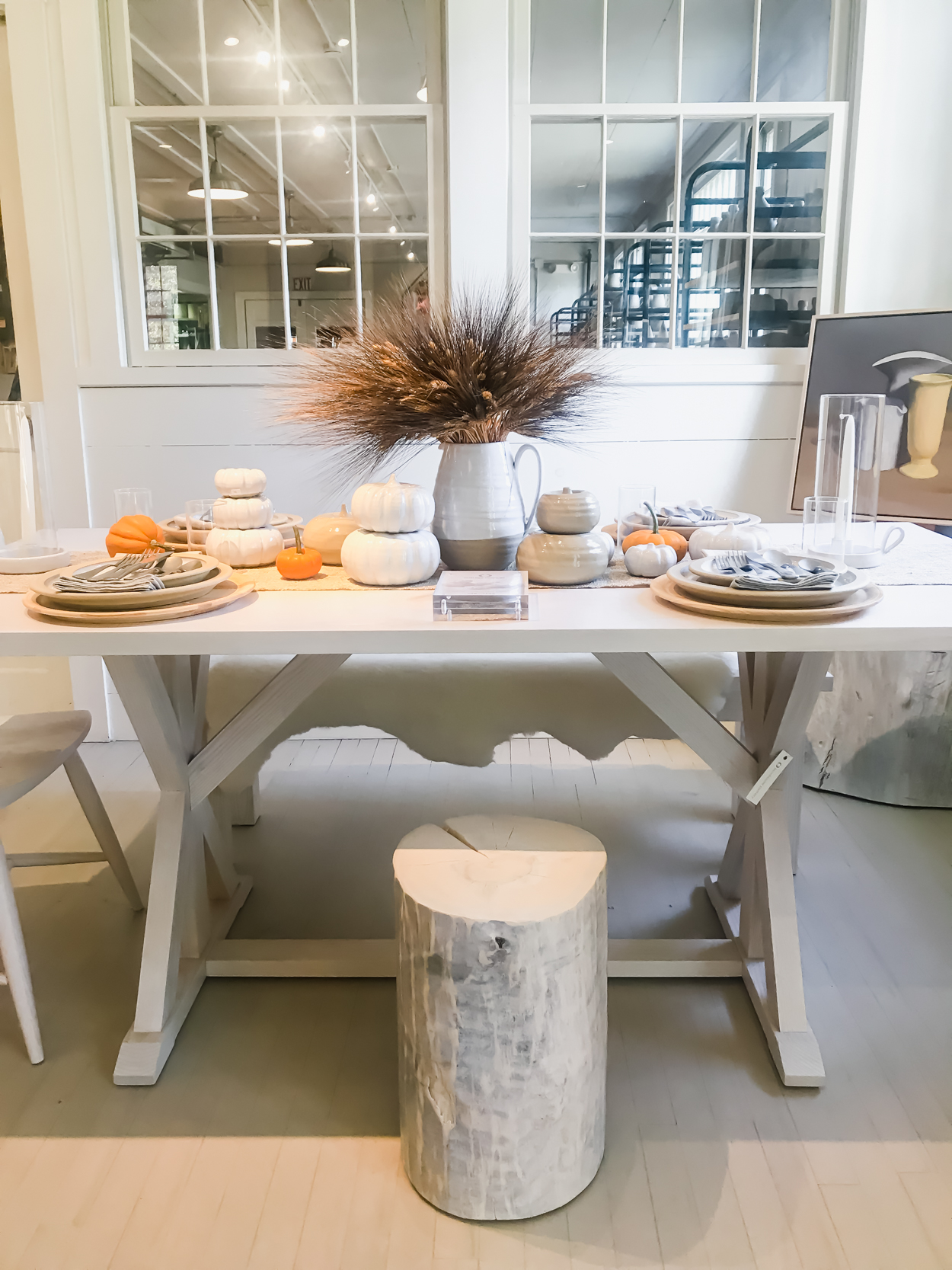 Pottery on a white farmhouse table in a potter studio in Woodstock Vermont 