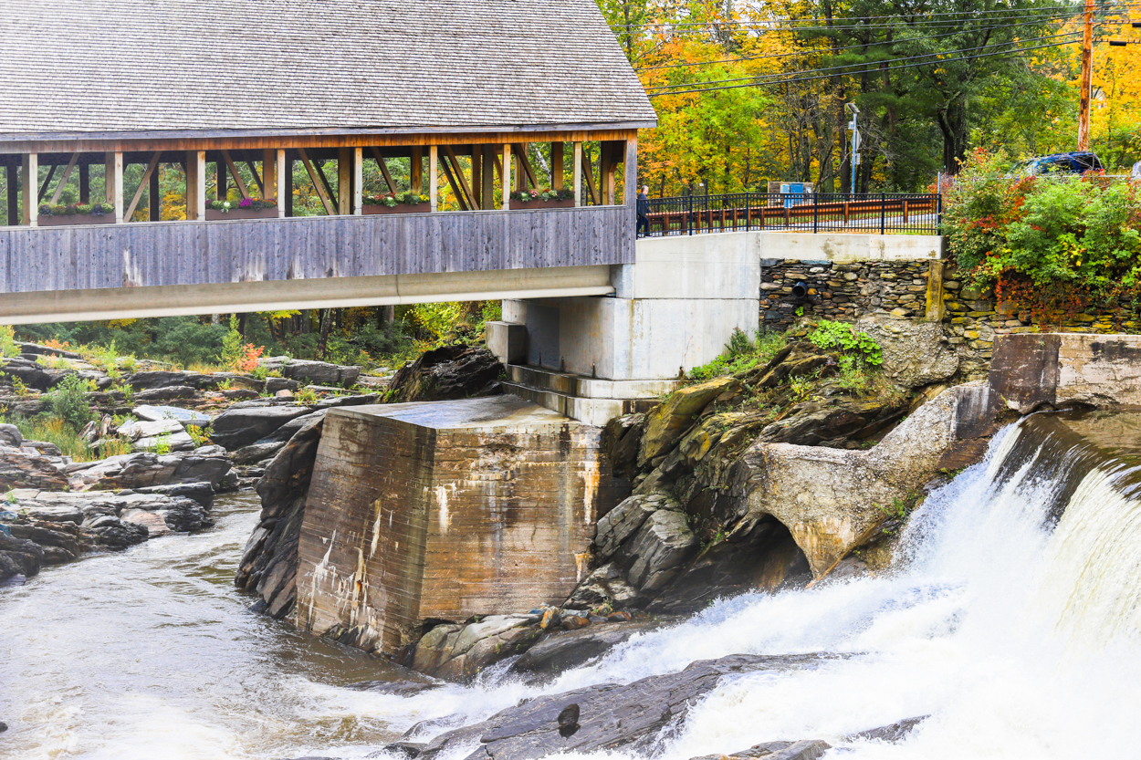 Covered bridge over the Ottauquechee River falls in Quechee Vermont