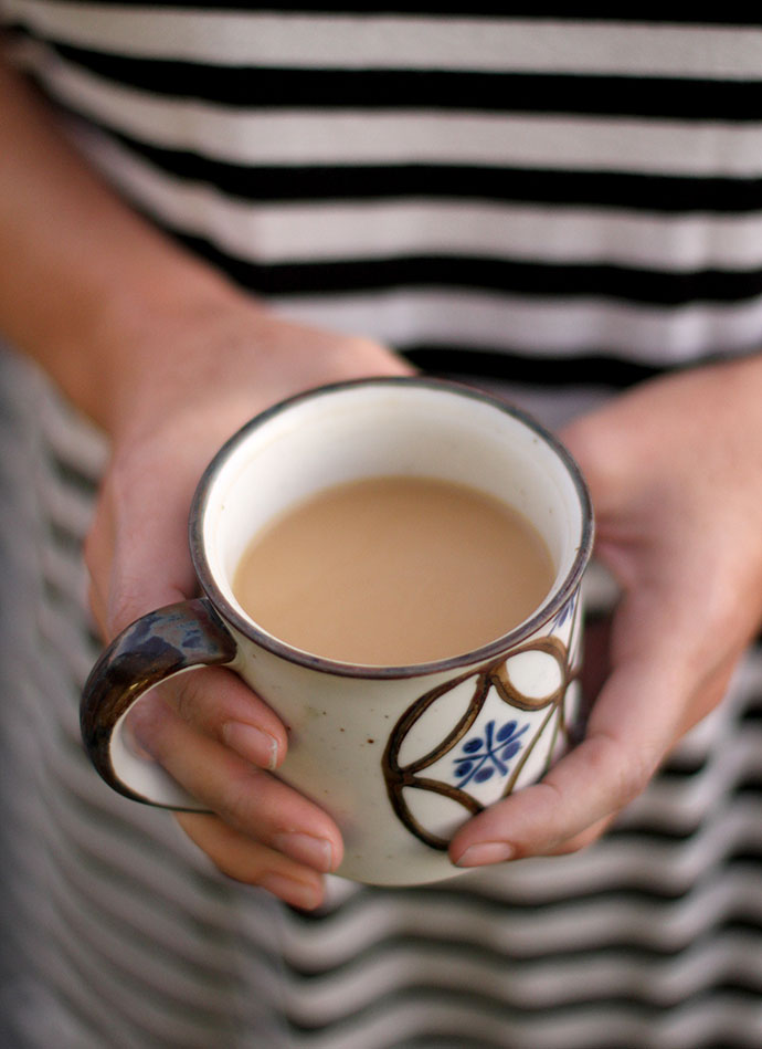 simple change number 6, Andrea holding a cup of coffee with cream