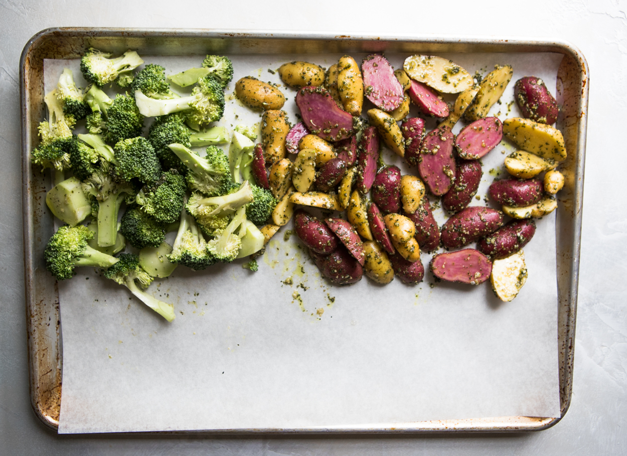 Broccoli and potatoes on a baking sheet