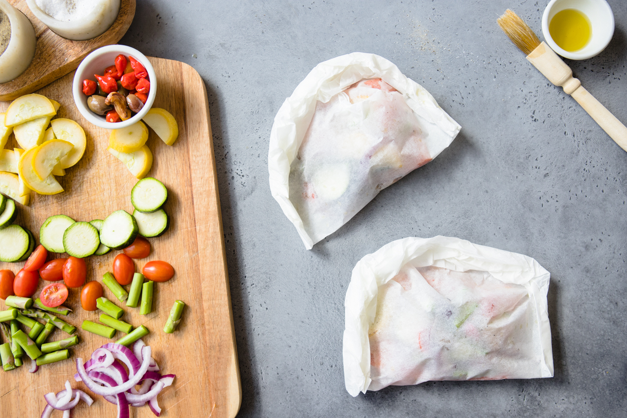 two parchment paper salmon packets