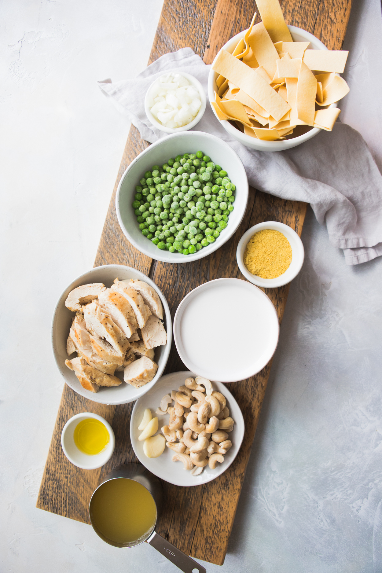 Instant Pot Chicken Alfredo ingredients in white bowls