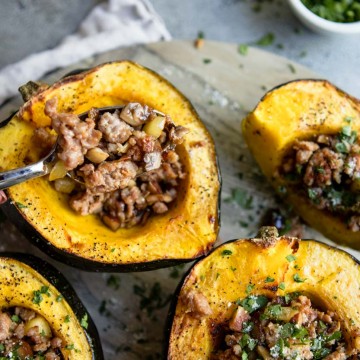 Roasted acorn squash with pork sausage and apple and chestnut stuffing