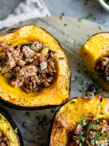 Roasted acorn squash with pork sausage and apple and chestnut stuffing