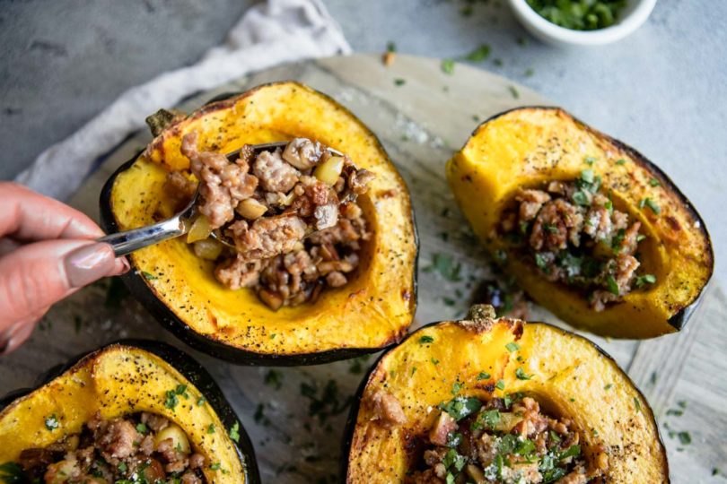 Roasted acorn squash with pork sausage and apple and chestnut stuffing