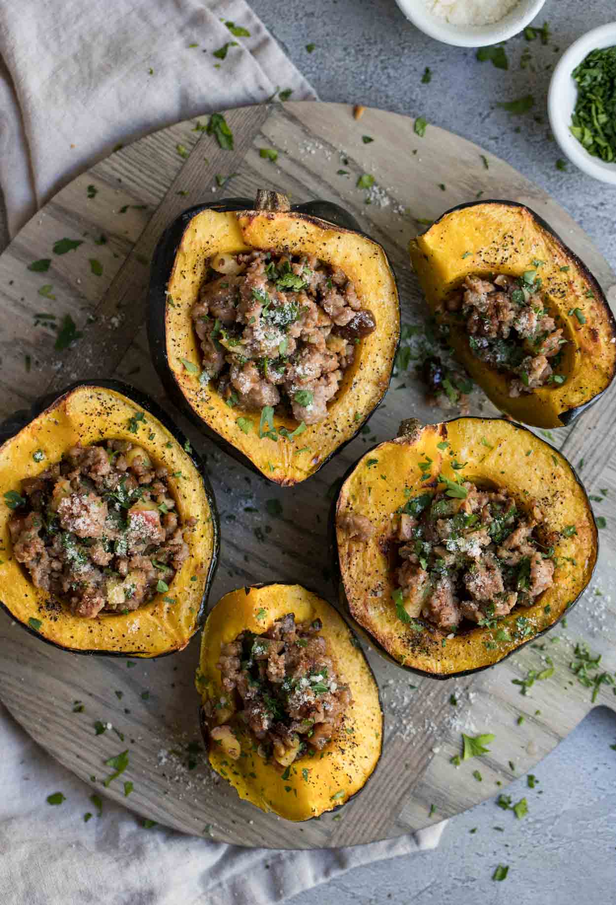 Roasted acorn squash with pork sausage and apple and chestnut stuffing