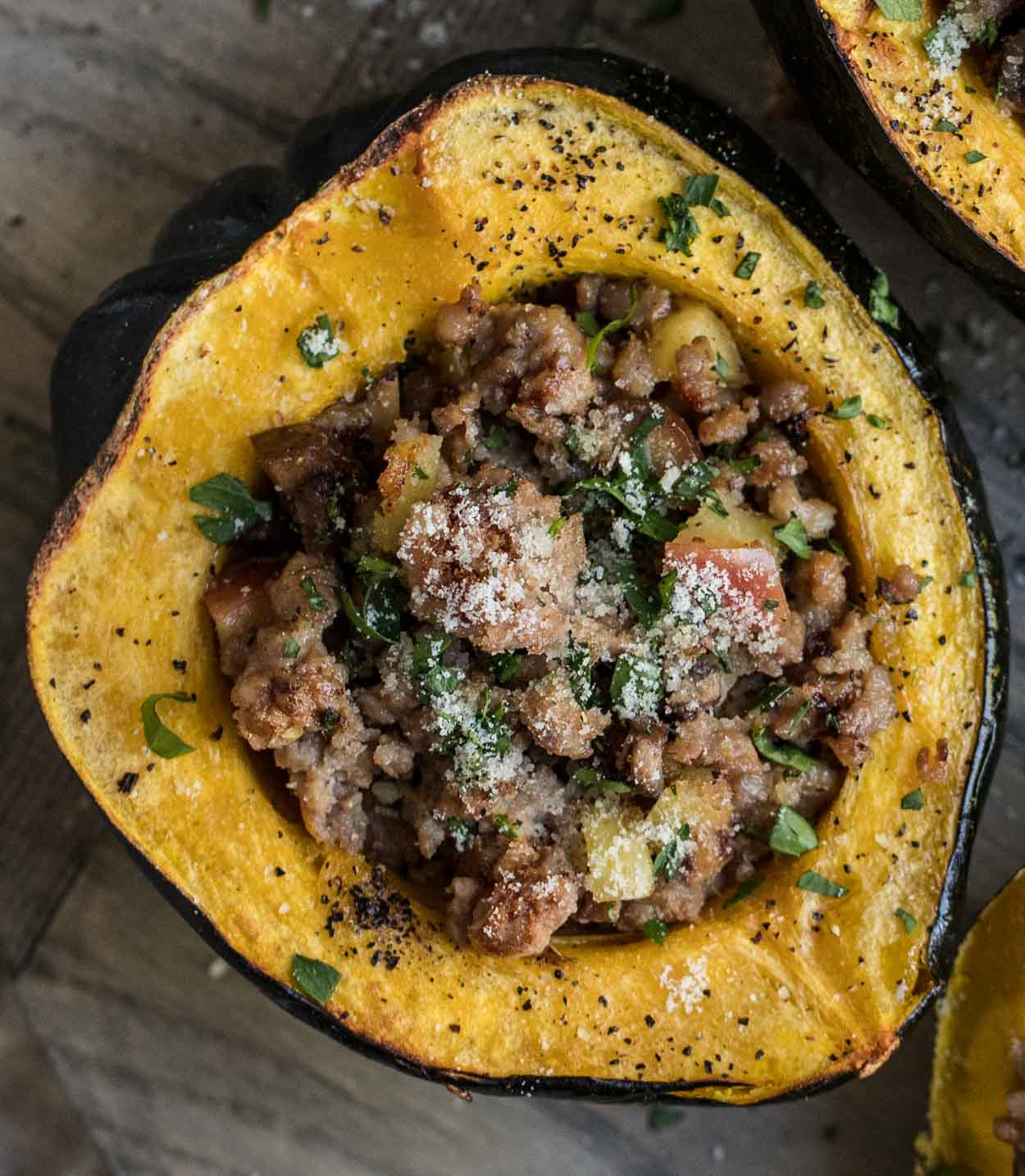 Roasted acorn squash with pork sausage and apple and chestnut stuffing