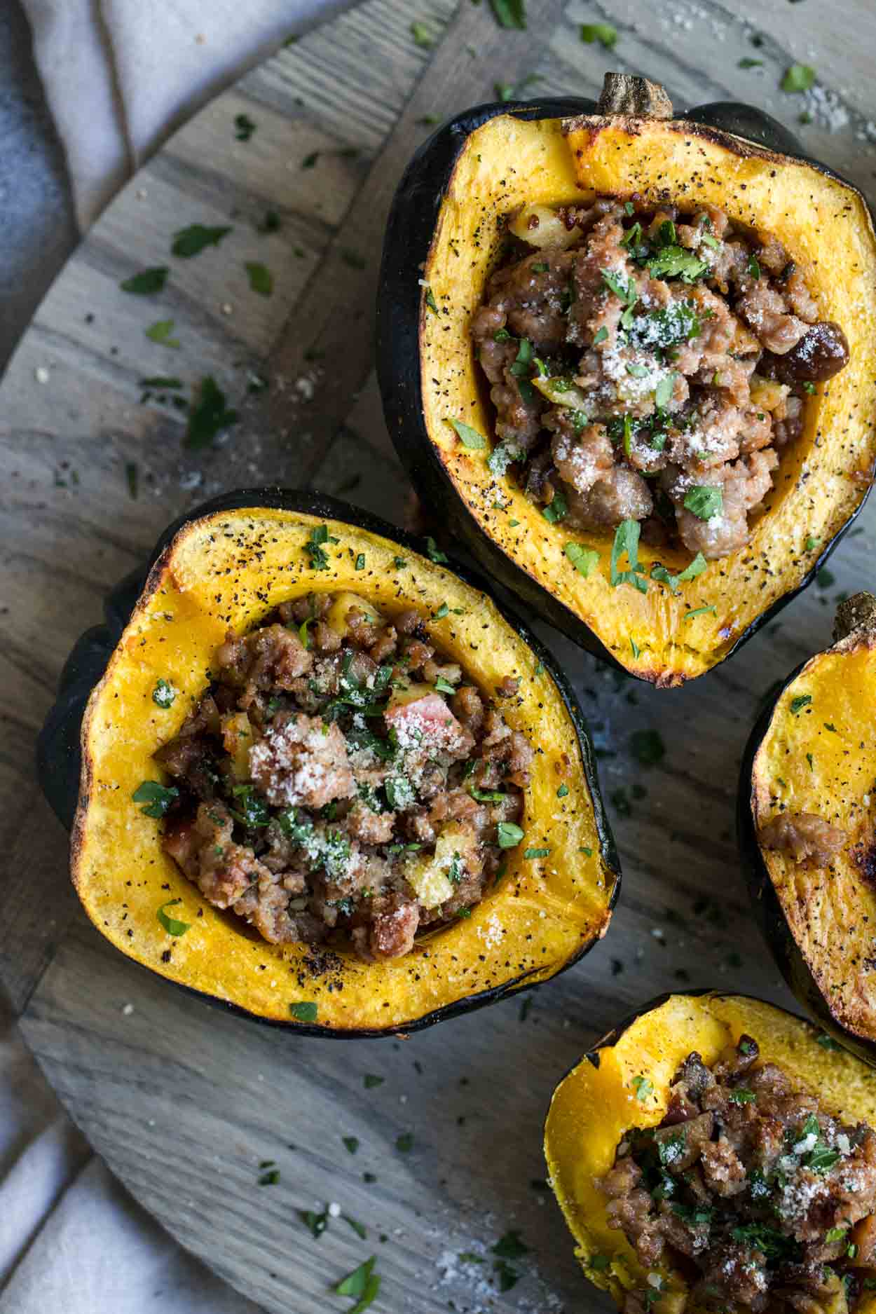Roasted acorn squash with pork sausage and apple and chestnut stuffing