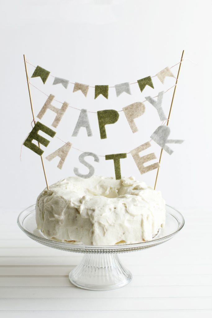 vanilla frosted bundt with a Happy Easter felt cake topper on top