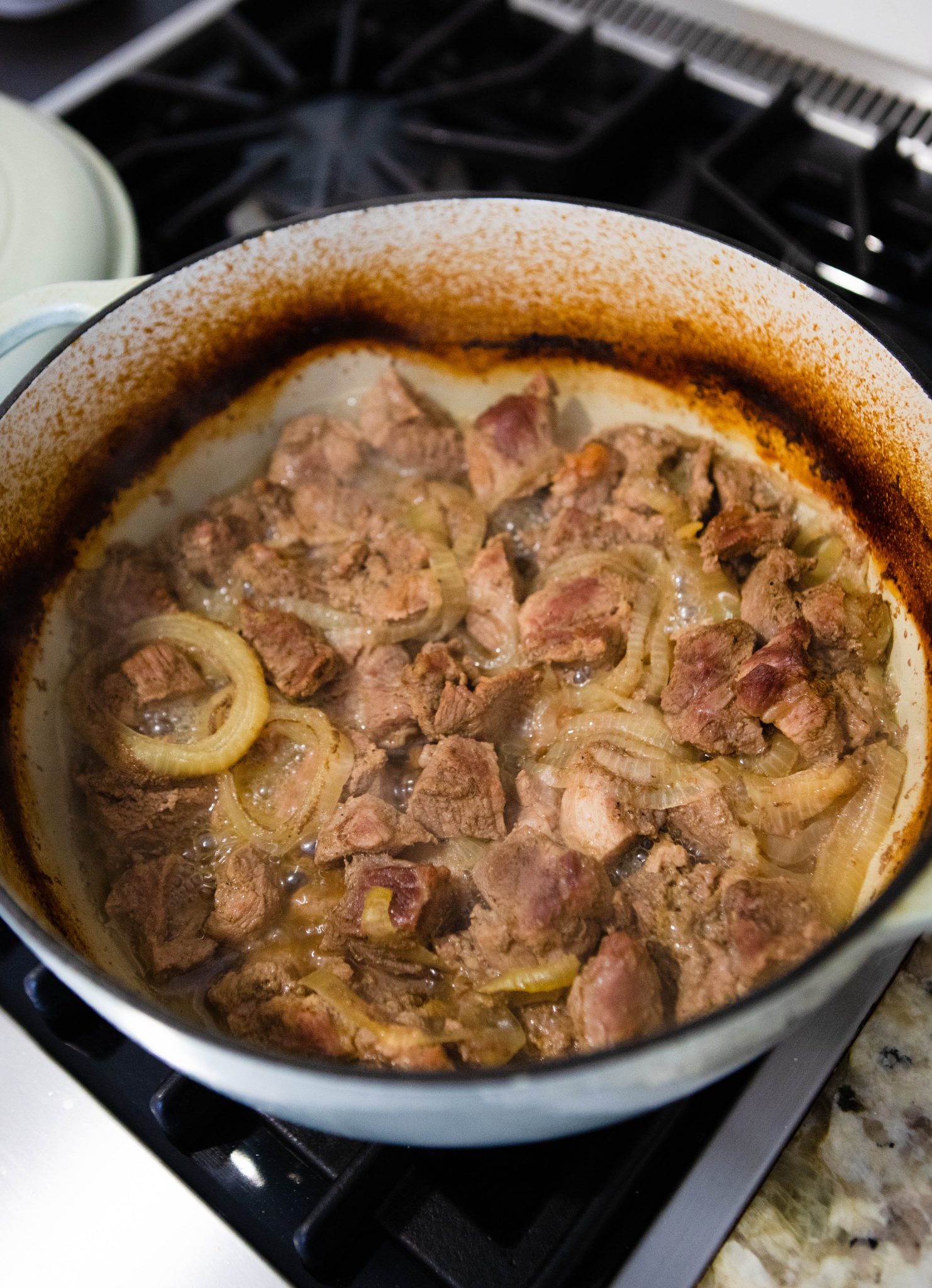 braised pork shoulder to make carnitas, in a Dutch oven