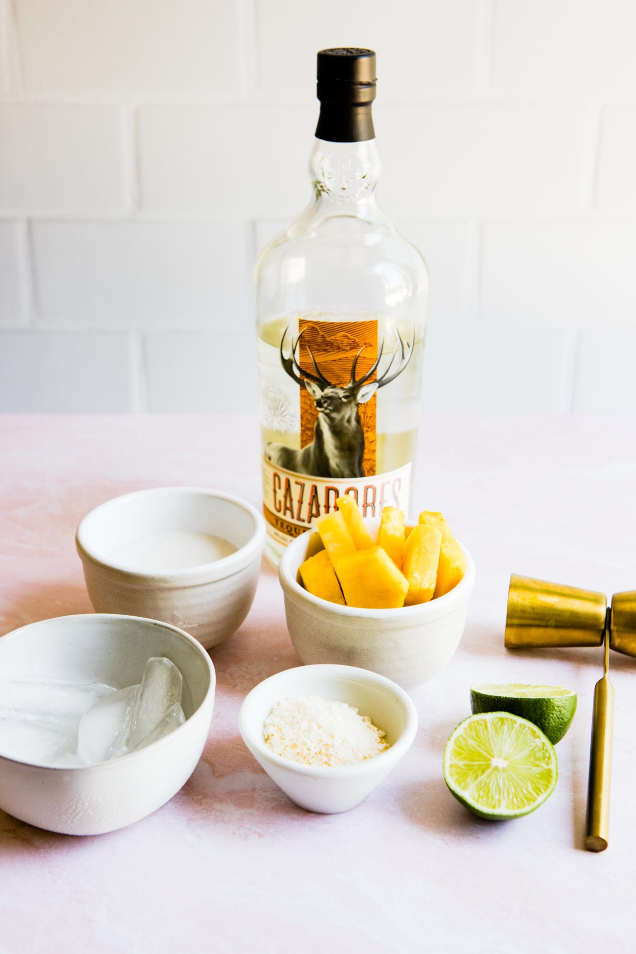 Cazadores tequila and ingredients to make pineapple margarita 