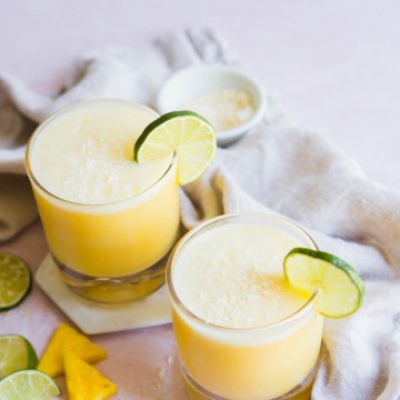 picture of 2 glasses filled with coconut pineapple margarita