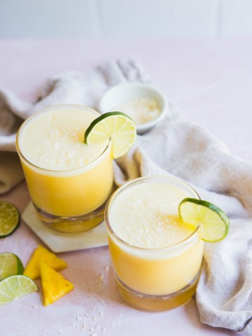 picture of 2 glasses filled with coconut pineapple margarita