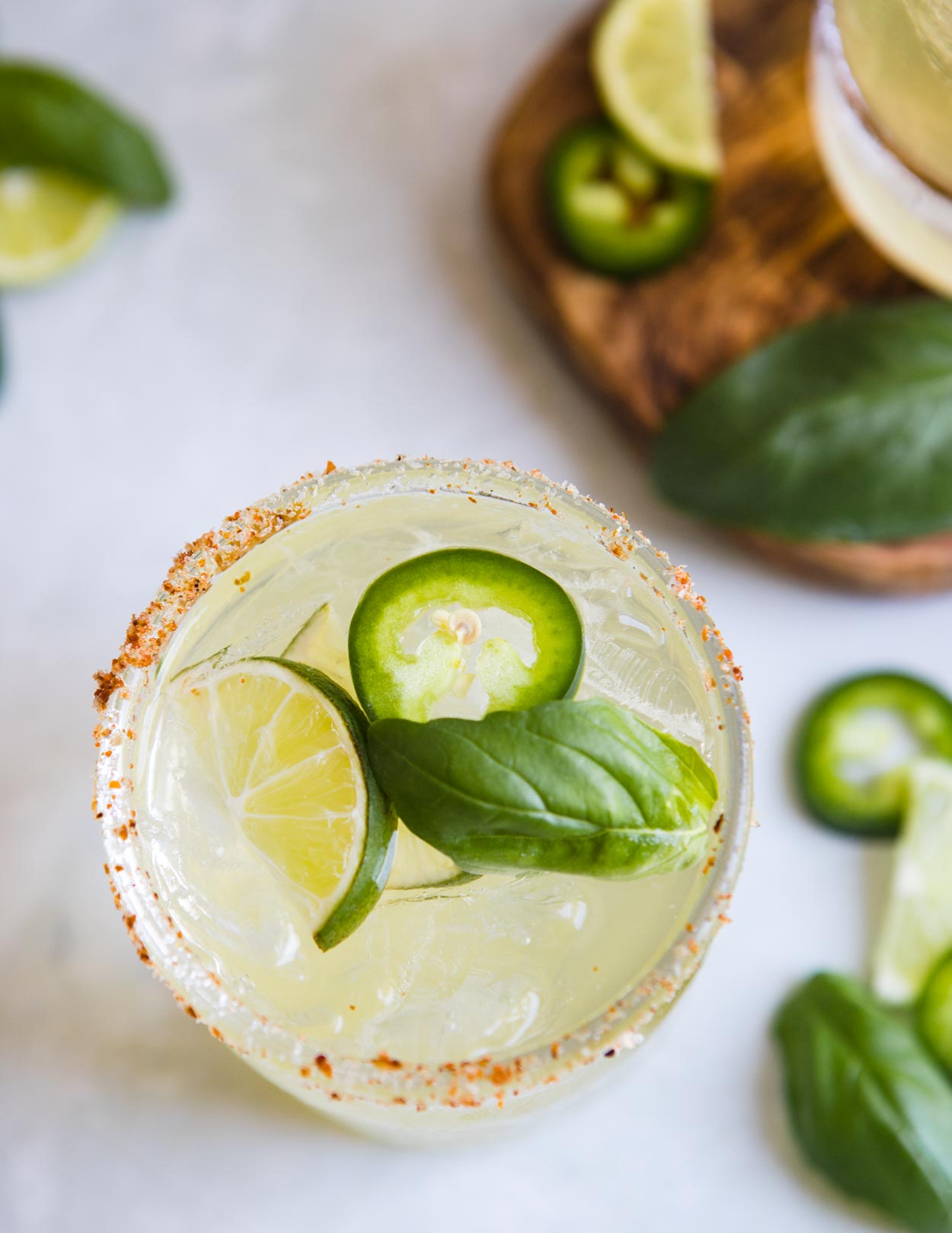 overhead shot of a cucumber jalapeno basil margarita 