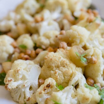 up close shot of roasted cauliflower with chickpeas and parsley