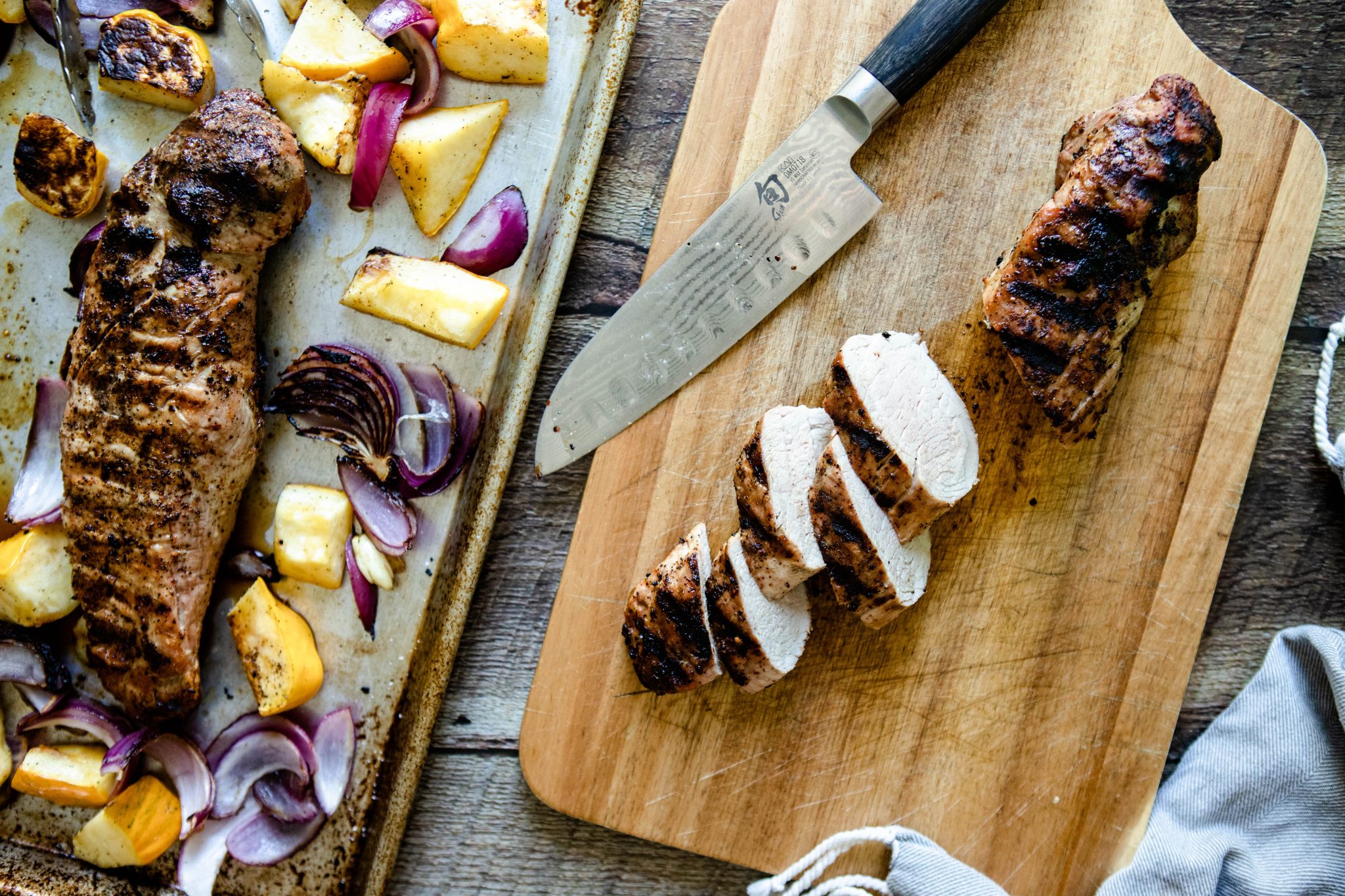 bbq pork tenderloin sliced on a cutting board