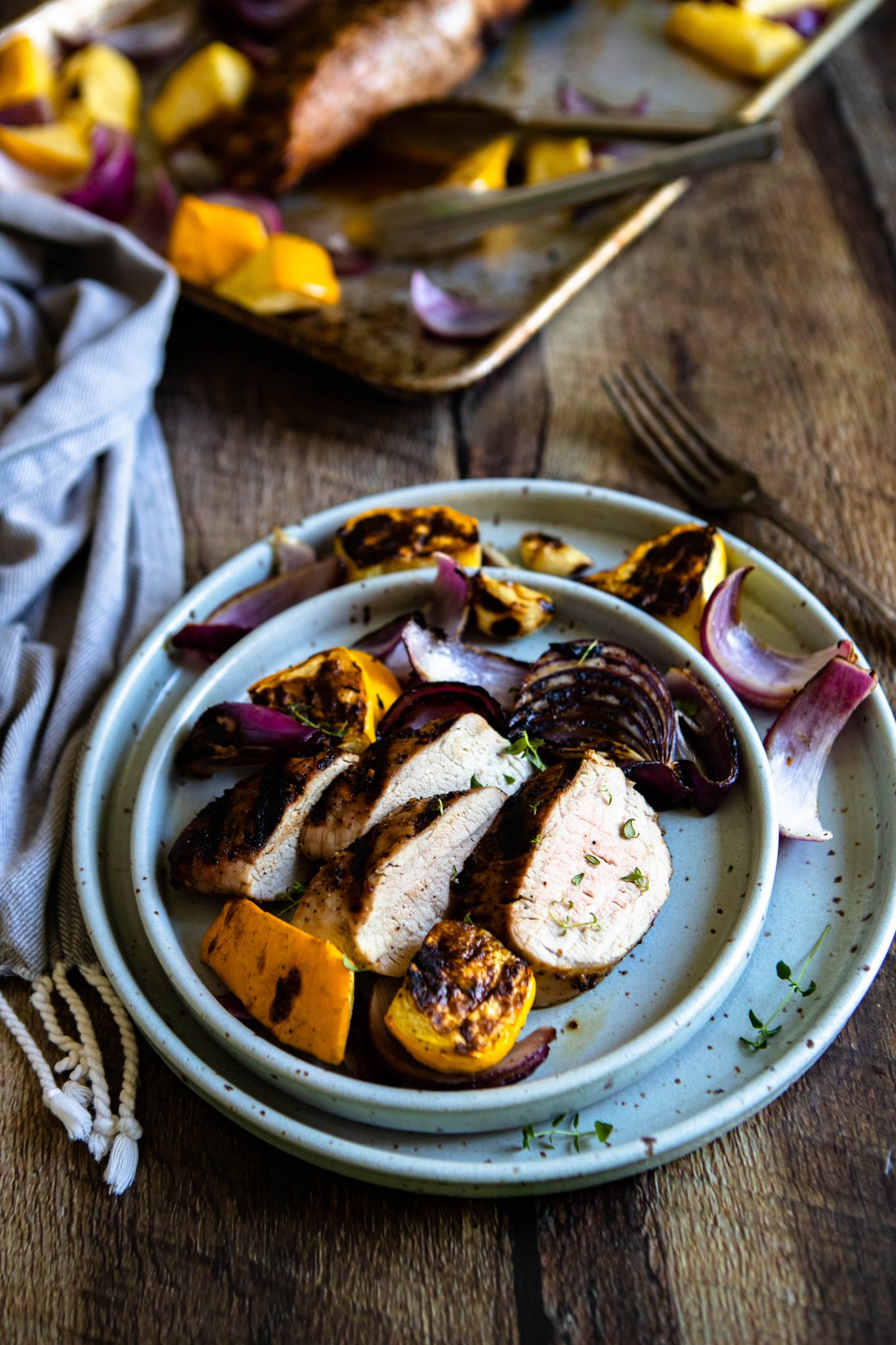 bbq pork loin and veggies on a plate