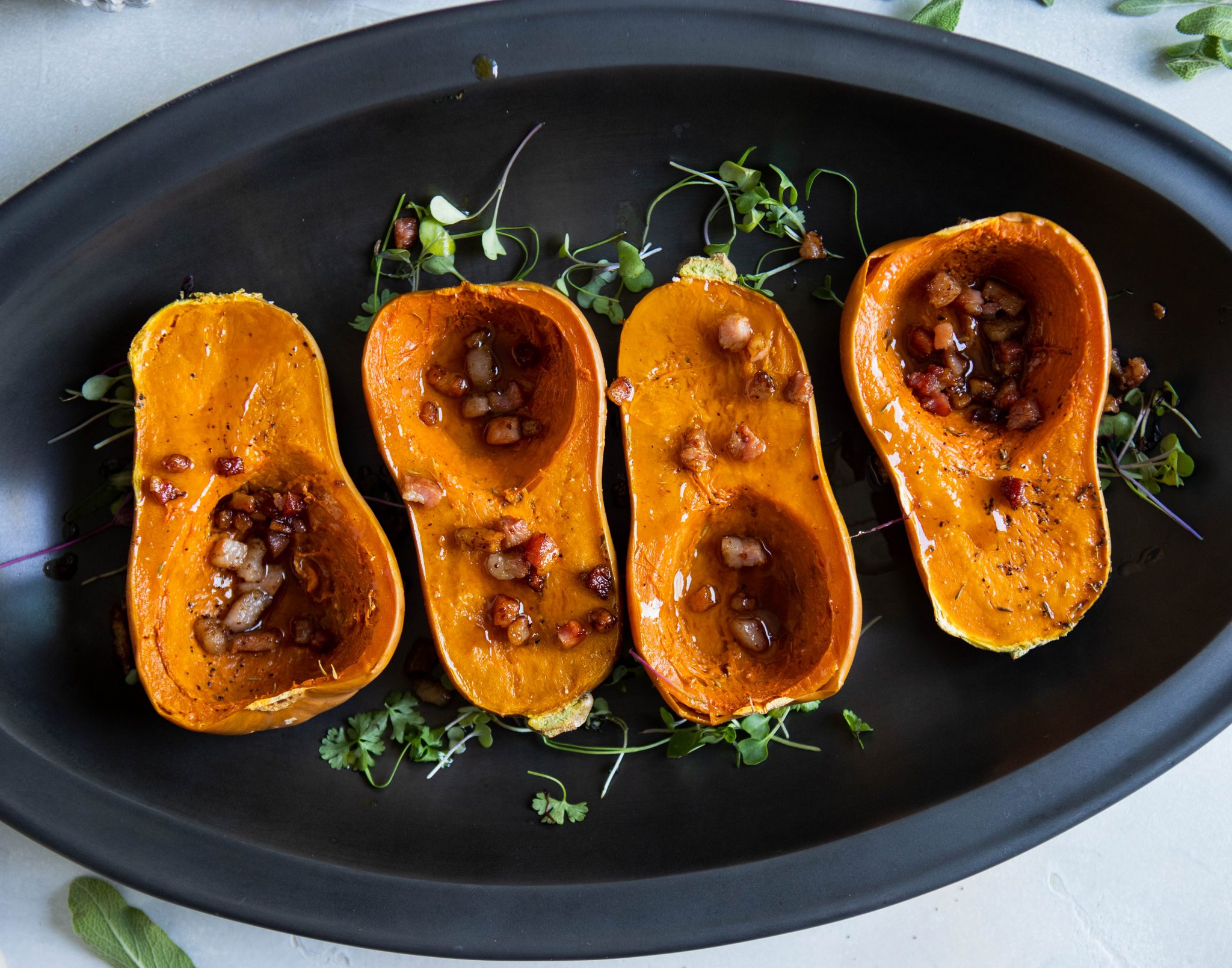 4 small butternut squashes with maple butter and pancetta sprinkled on top