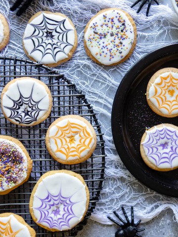 Halloween cookie ideas on a white cloth against a gray background