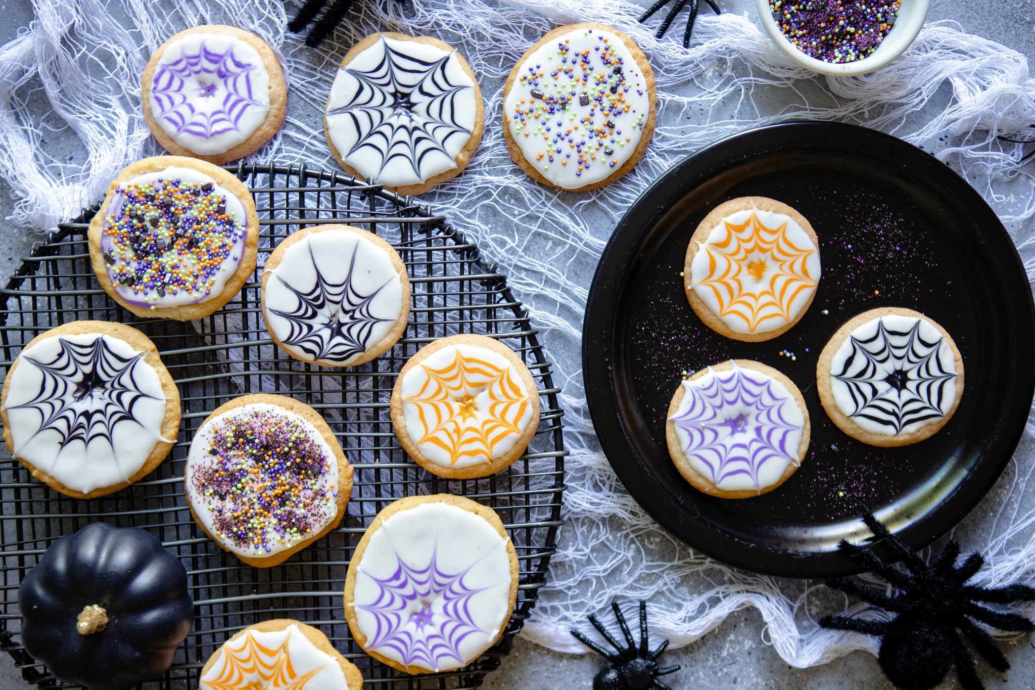 Halloween cookie ideas on a white cloth against a gray background
