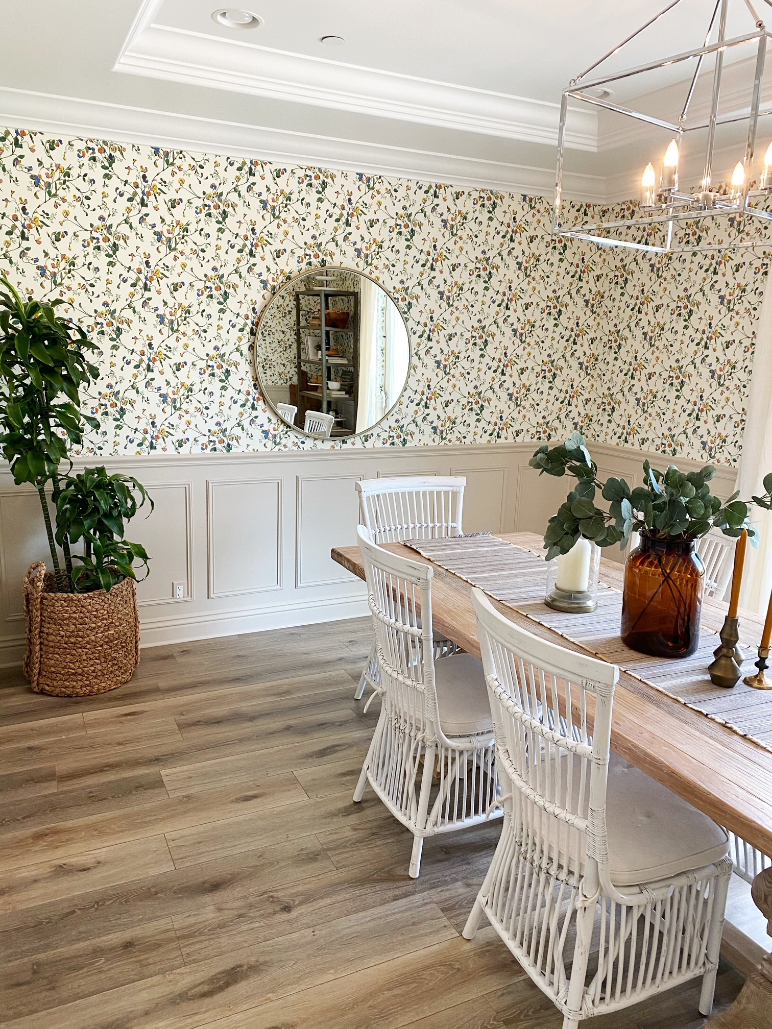 dining room with floral wallpaper and picture frame molding