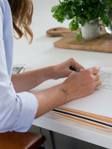 woman writing in a journal