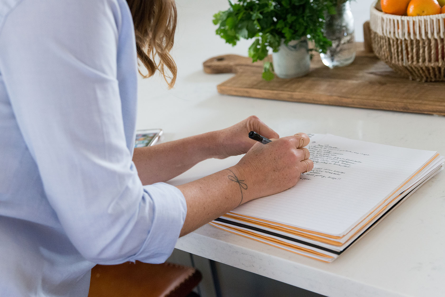 woman writing in a journal