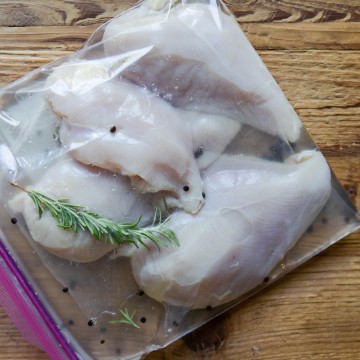chicken breasts in a ziploc bag being brined
