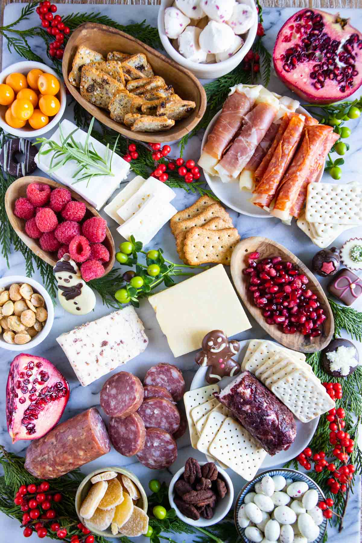 sweets and crackers added into a holiday grazing board