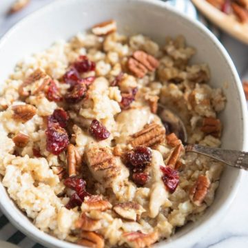 oatmeal made with egg whites and loaded with toppings in a white bowl