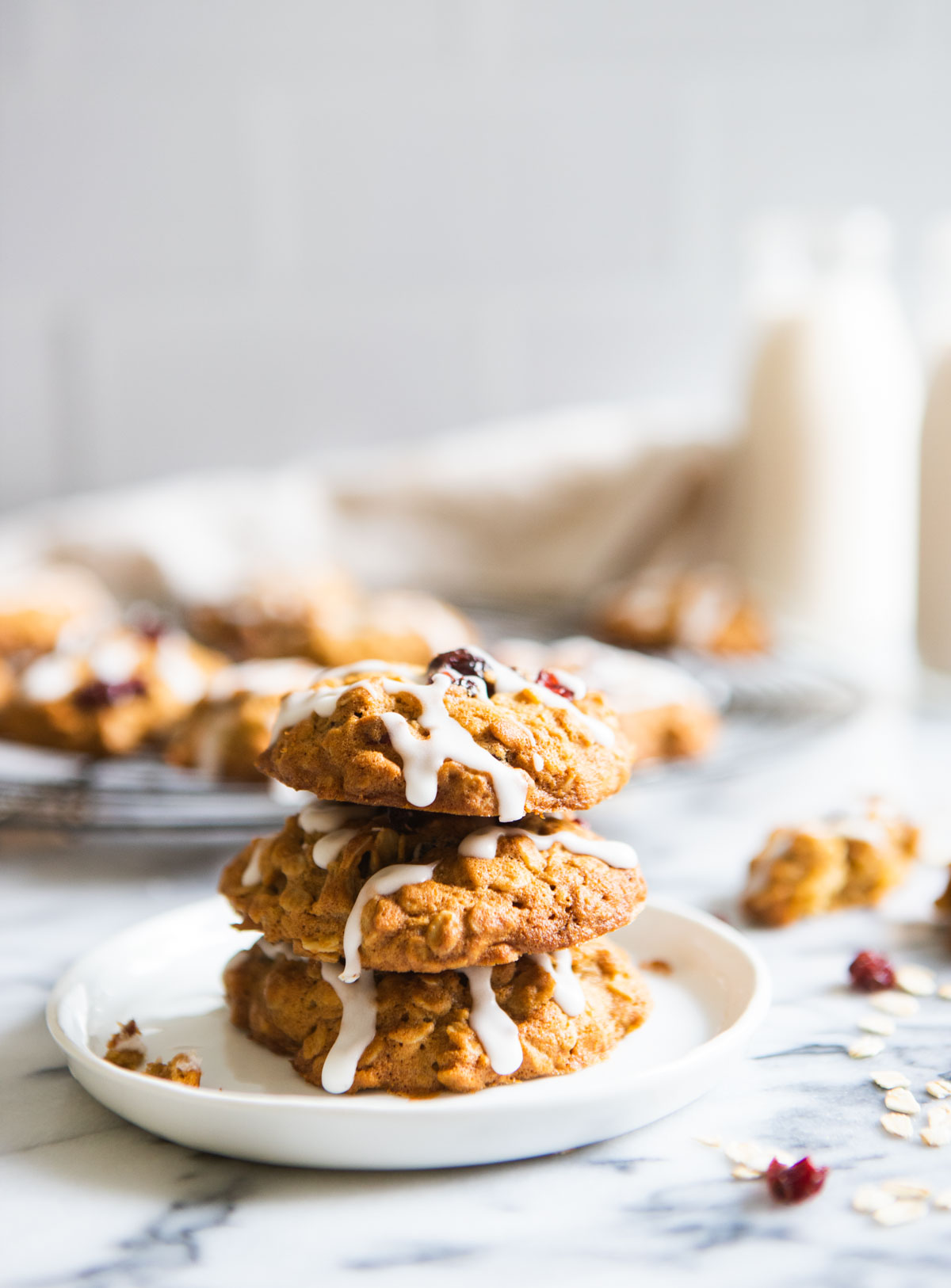 stack of oatmeal craisin cookies on white plate
