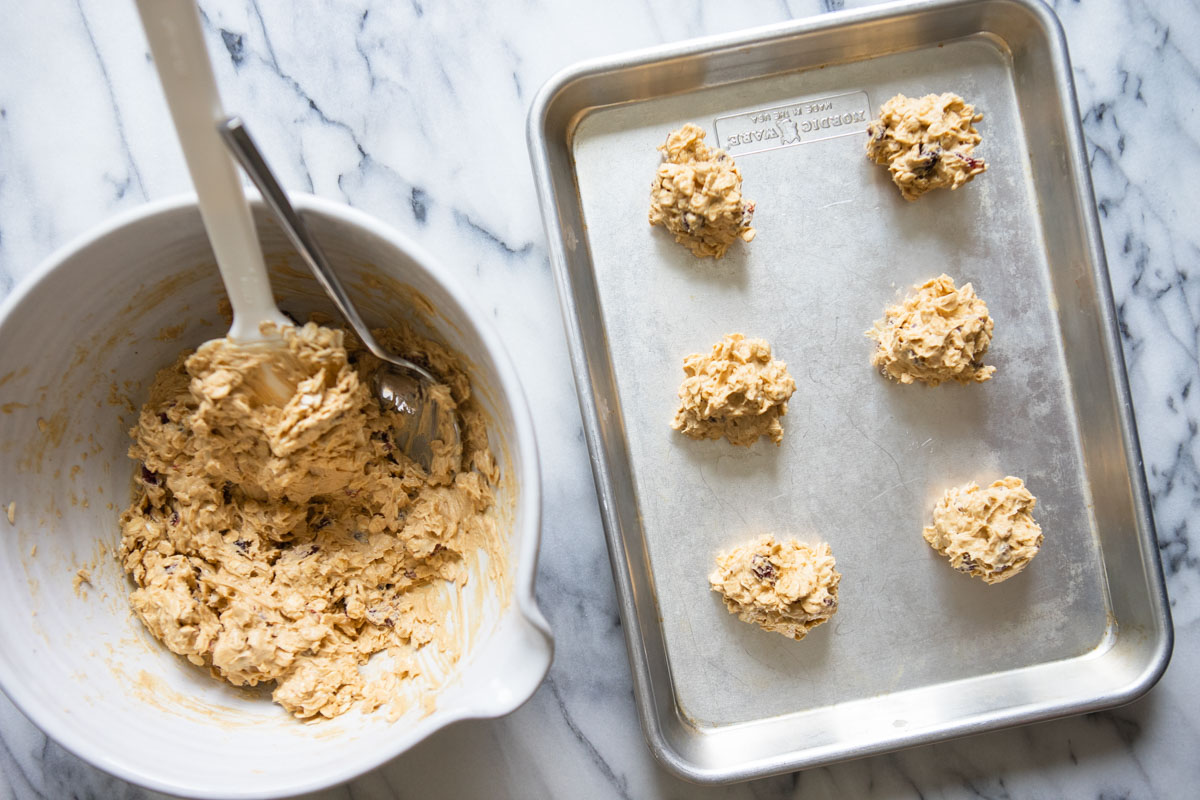 oatmeal cookies dropped onto a cookie sheet