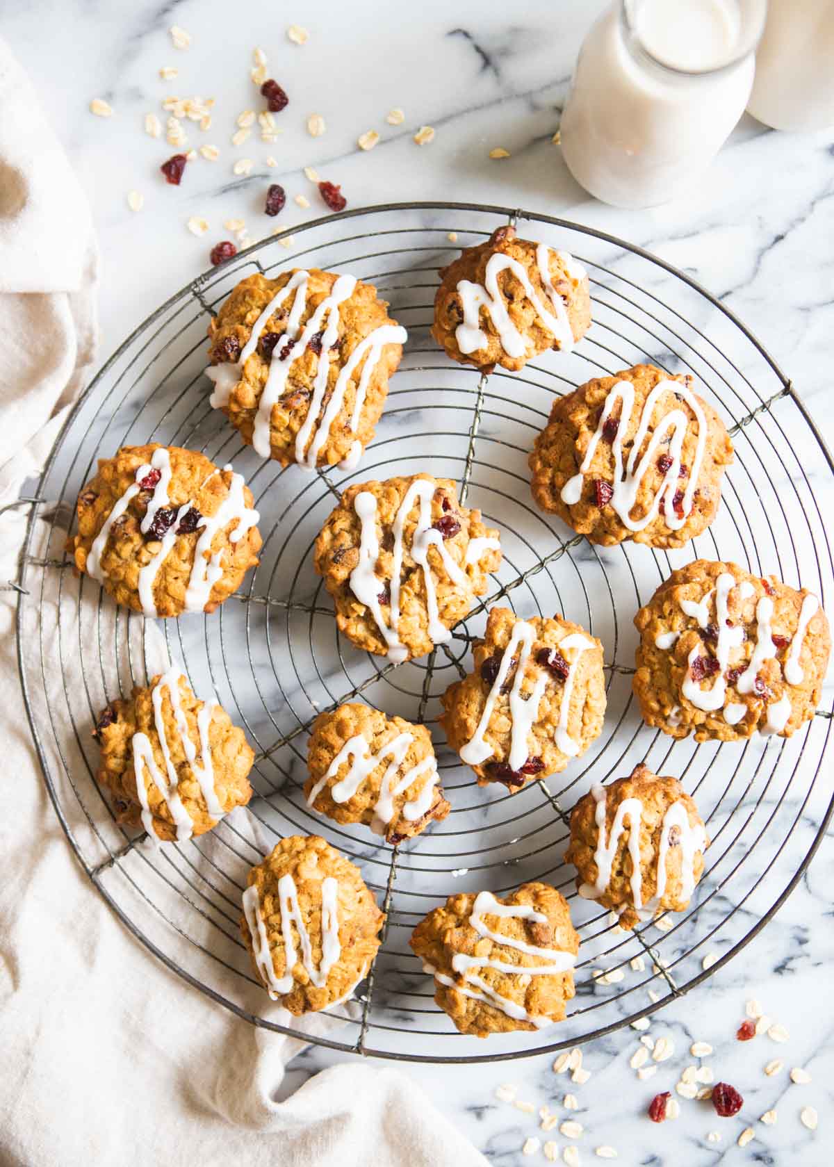 round baking tray filled with oatmeal craisin cookies and a maple glaze 