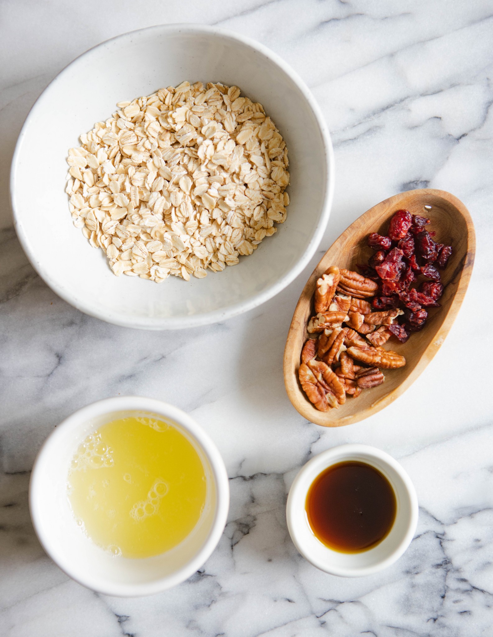  pecans, cranberries and syrup in little white bowls