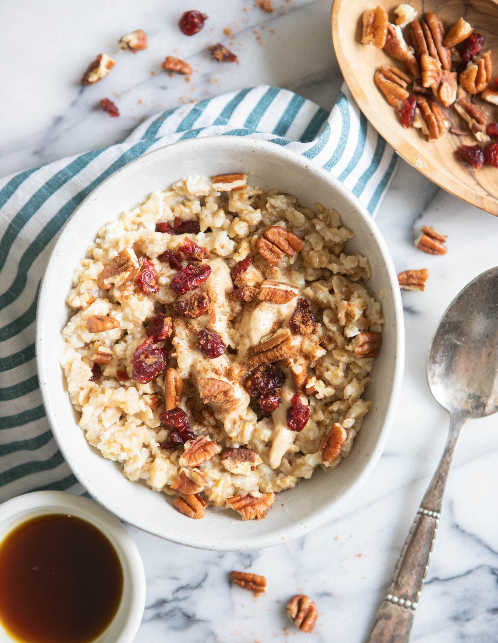 oatmeal in a white bowl with toppings