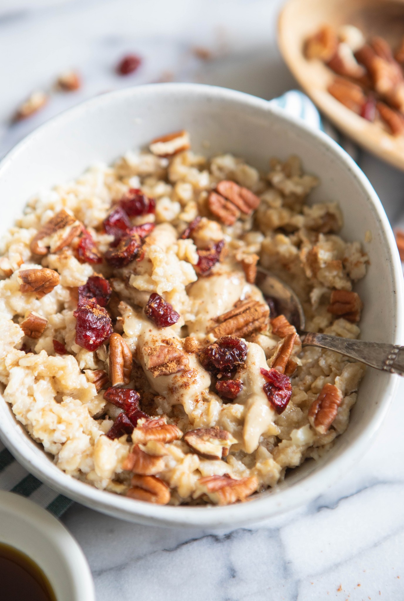 high protein egg white oatmeal with toppings in a white bowl