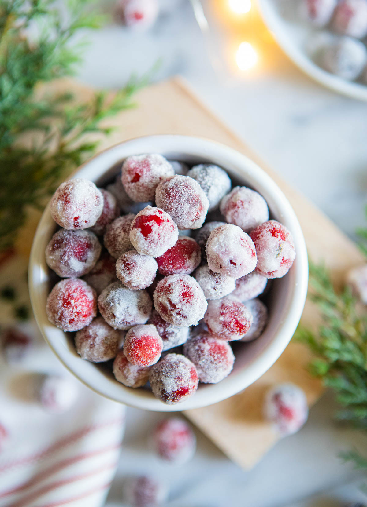 white bowl filled with candy cranberries 