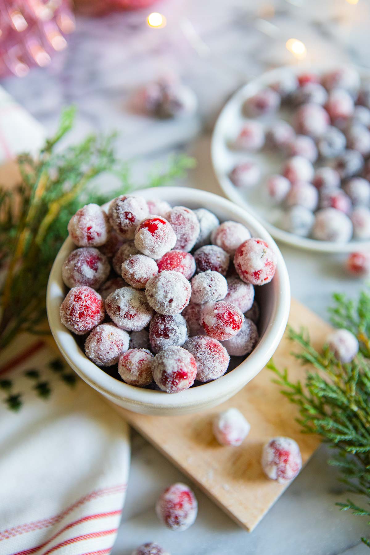 sugared cranberries in a white bowl